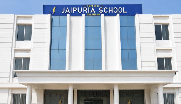 Seth M R Jaipuria School Salempur - Jaipuria Schools - Jaipuria Schools Front facade of Jaipuria School building with a blue sign reading JAIPURIA SCHOOL at the top of the entrance.